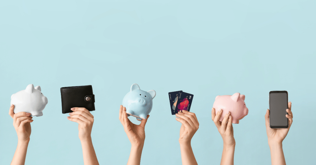 Hands appear from the bottom of the page holding up piggy banks, wallets and credit cards.