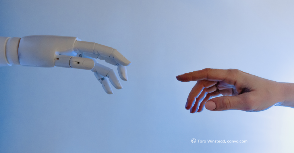 A robot hand and a human hand reach out to touch_by Tara Winstead, canva.com